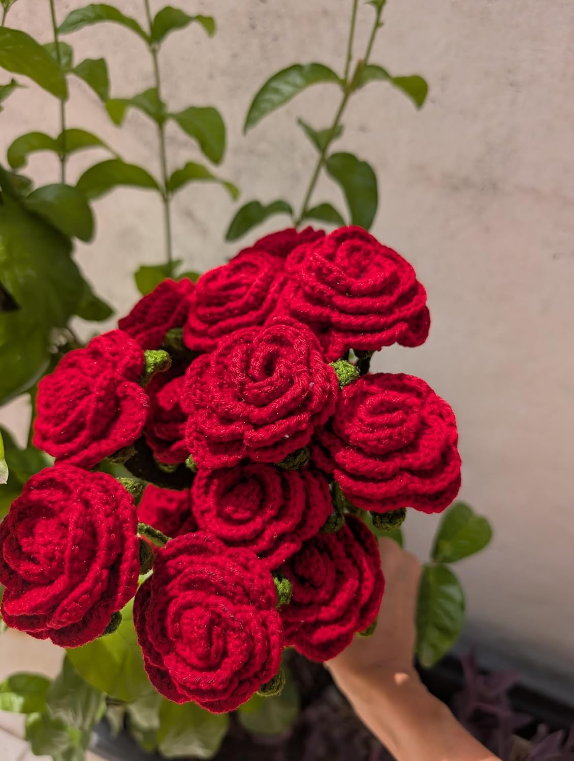 Beautiful handmade crochet rose bouquet tied with a red ribbon, long-lasting alternative to fresh flowers.