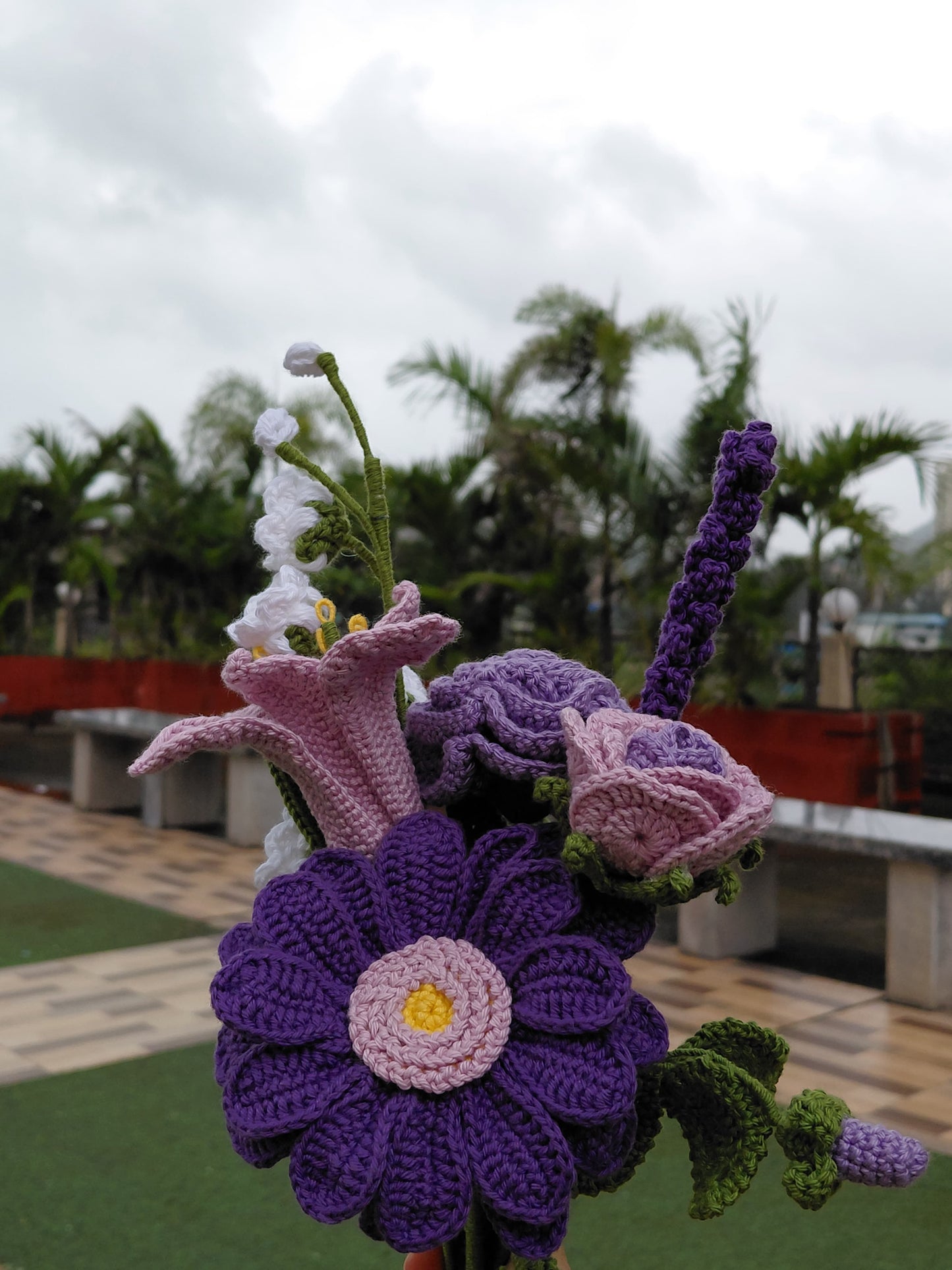 Handmade crochet flower bouquet with purple daisy, pink roses, and lavender, eco-friendly gift for home décor and special occasions.