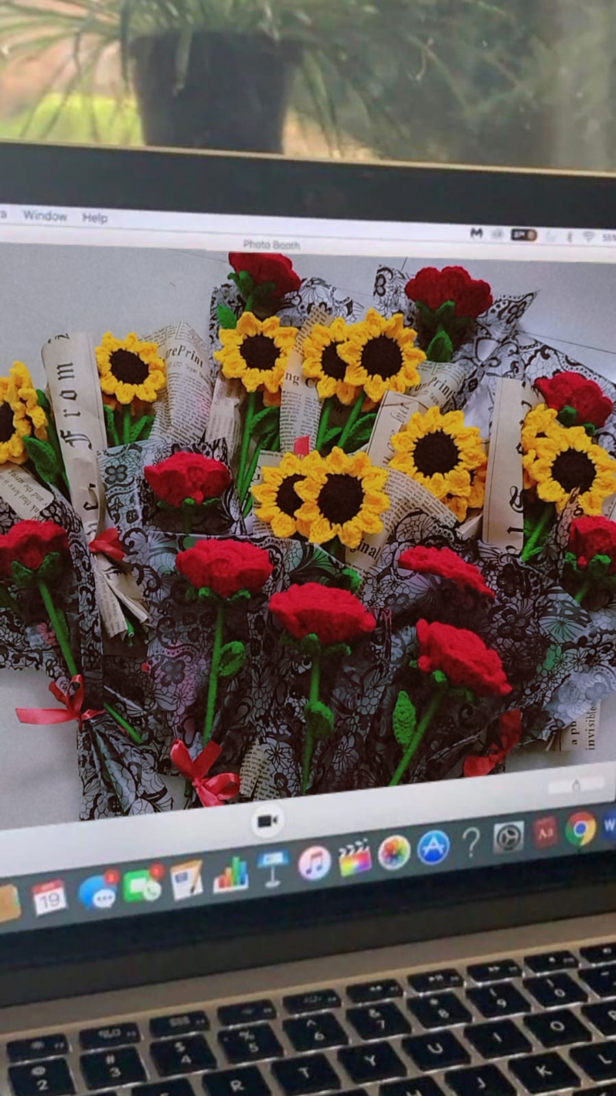 Handmade crochet red rose bouquet wrapped in black paper with a red ribbon, unique gift for special occasions.