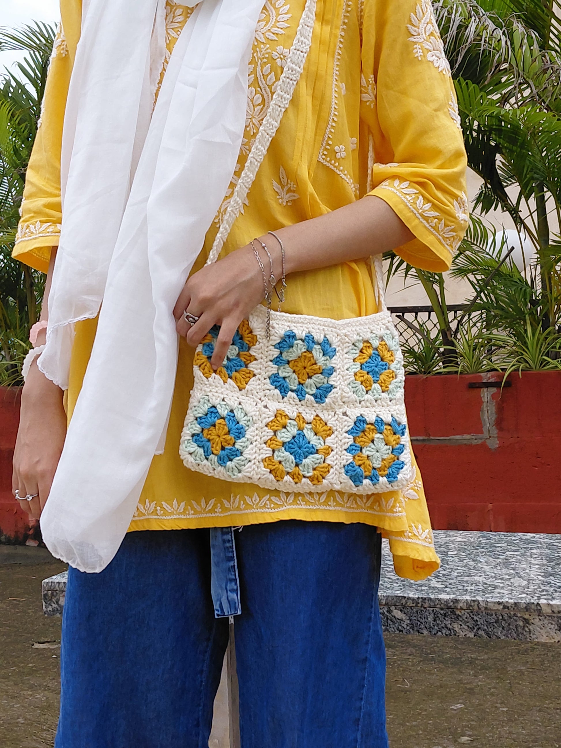 Unique handmade crochet bag with colorful granny square pattern, fashionable eco-conscious handbag for women.