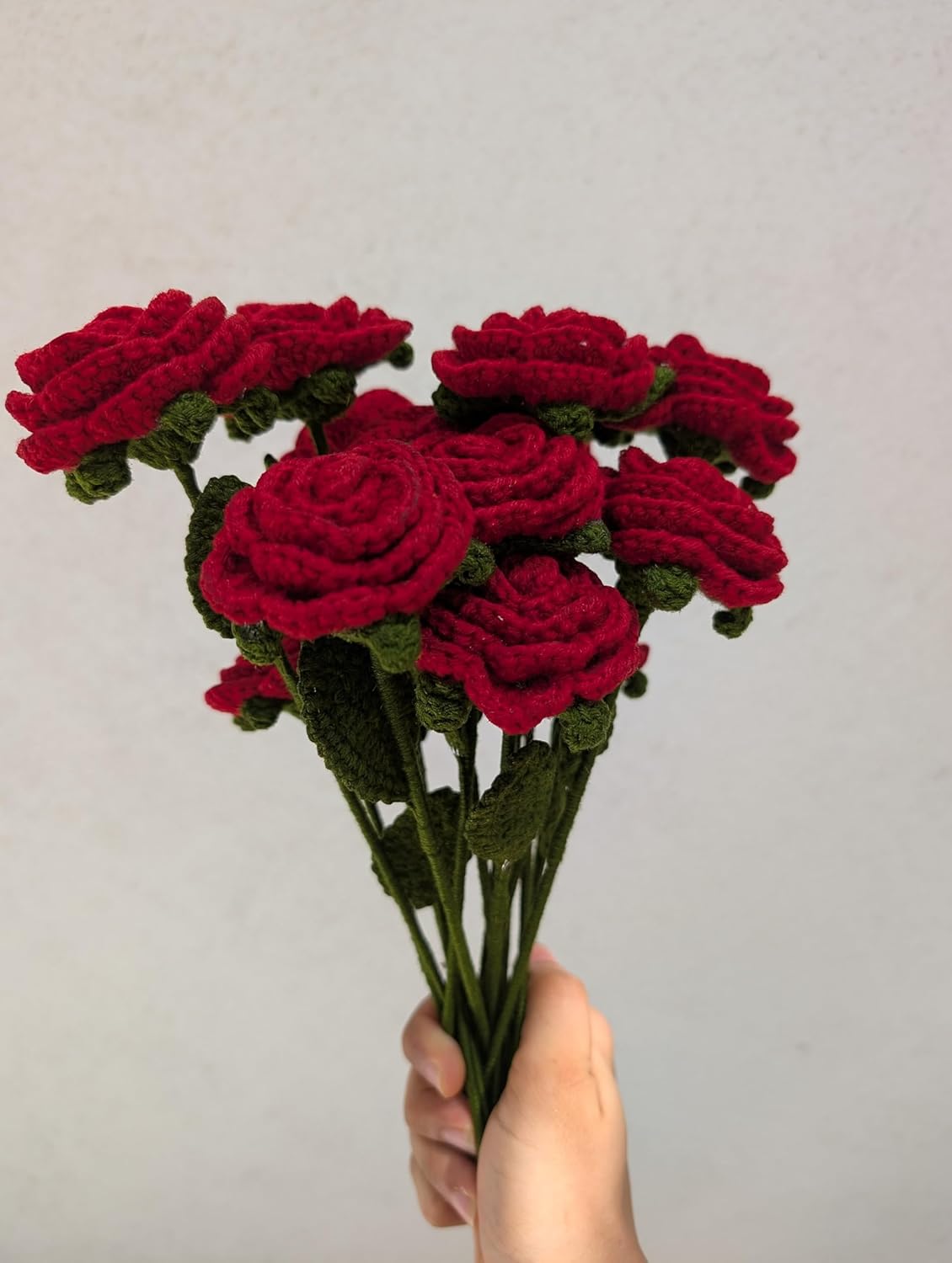 Beautiful handmade crochet rose bouquet tied with a red ribbon, long-lasting alternative to fresh flowers.