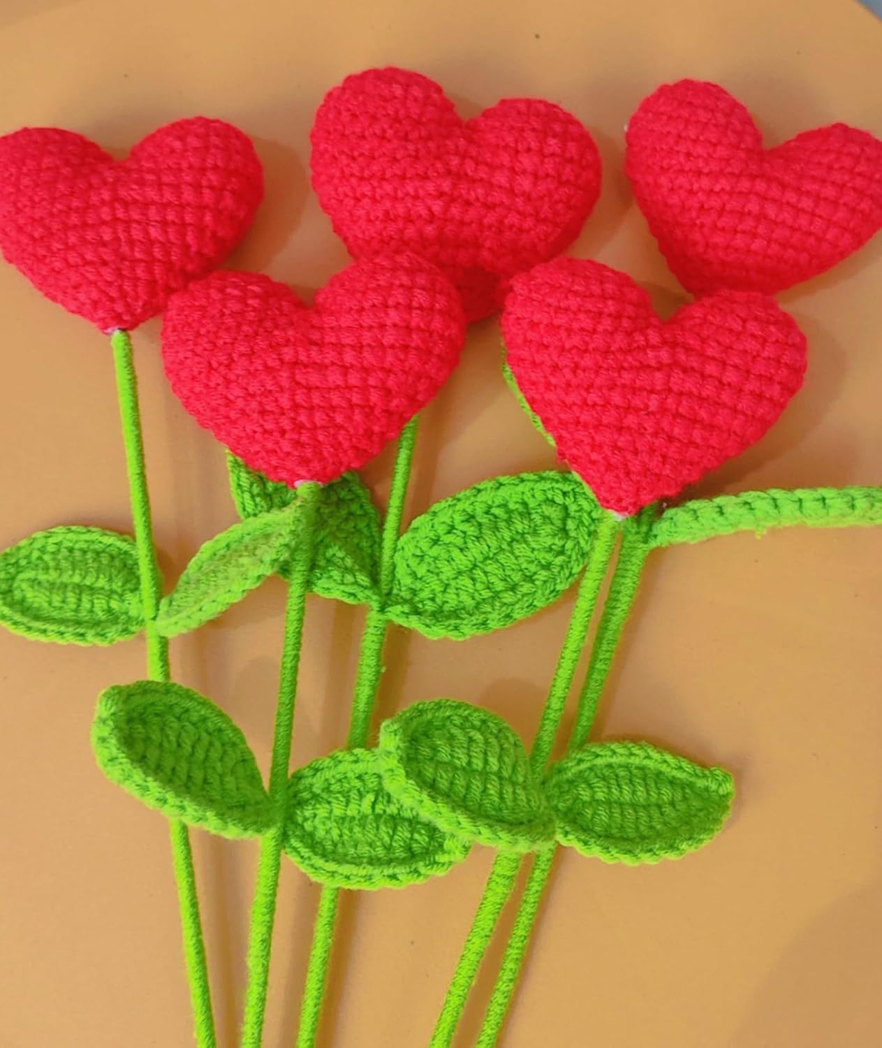 Unique crochet heart plushie bouquet with red hearts and green leaves, ideal for Valentine’s and anniversaries.