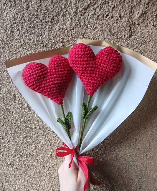 Handmade crochet heart-shaped plushie bouquet with green stems, perfect romantic gift for special occasions.