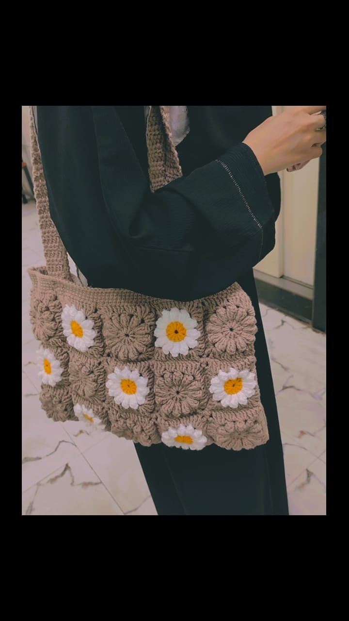 Crochet floral granny square handbag, trendy sustainable bag for women, matching Gen Z fashion and eco-conscious style.
