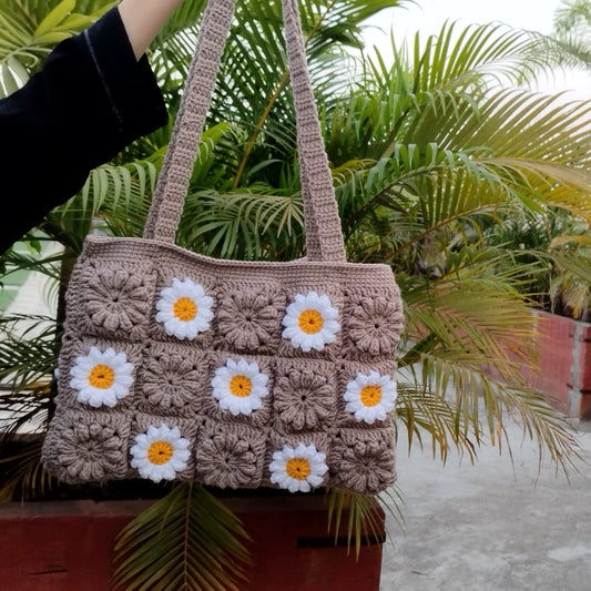 Crochet handbag with daisy flower pattern, sustainable and stylish fashion bag perfect for Gen Z and boho trends.